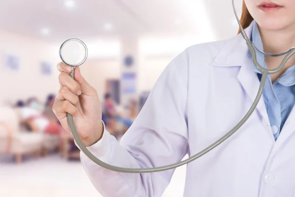 Close up stethoscope with female doctor in hospital — Stock Photo, Image