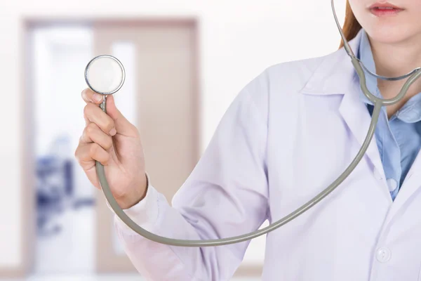 Close up stethoscope with female doctor in hospital — Stock Photo, Image