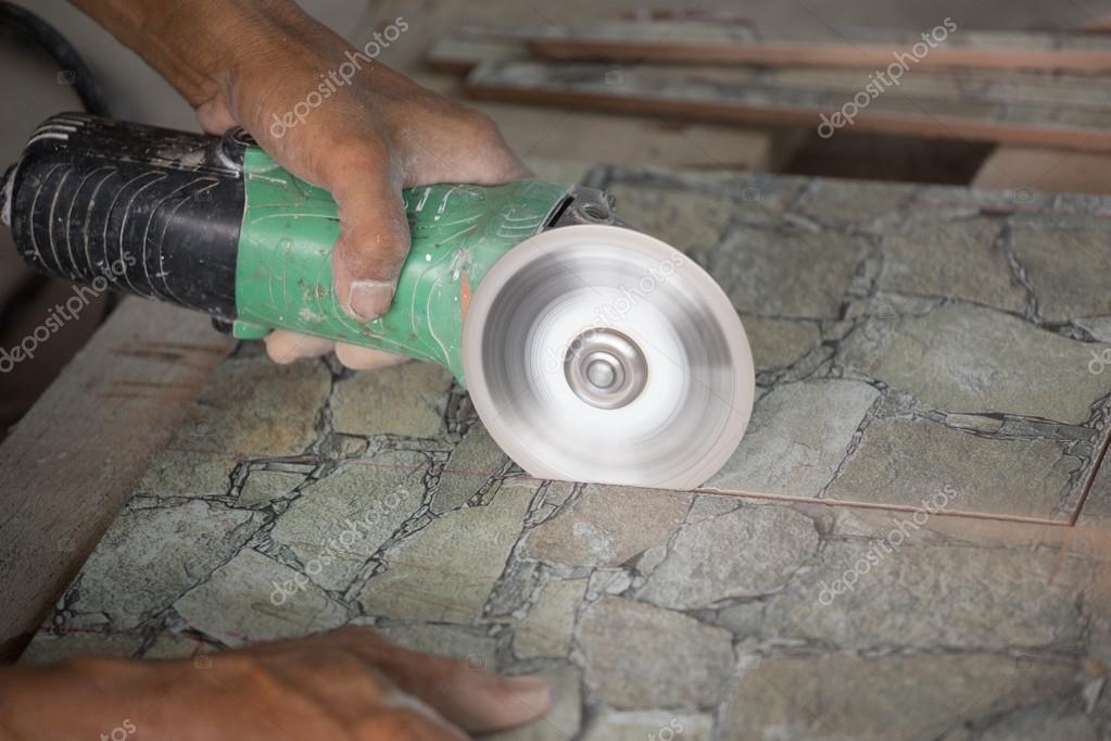 Construction Worker Cutting A Tile, Cutting Slate Tile With Angle Grinder