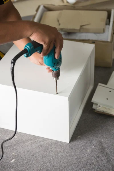 Assembling Furniture with a screwdriver — Stock Photo, Image