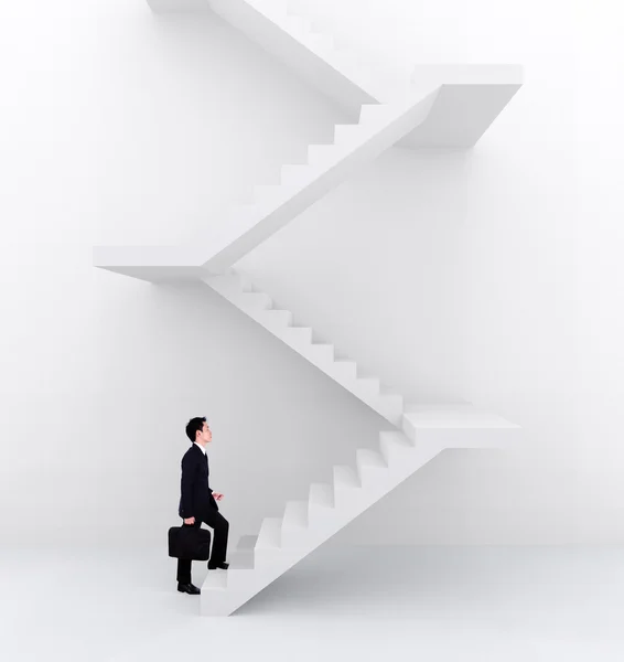 Hombre de negocios subiendo escaleras — Foto de Stock