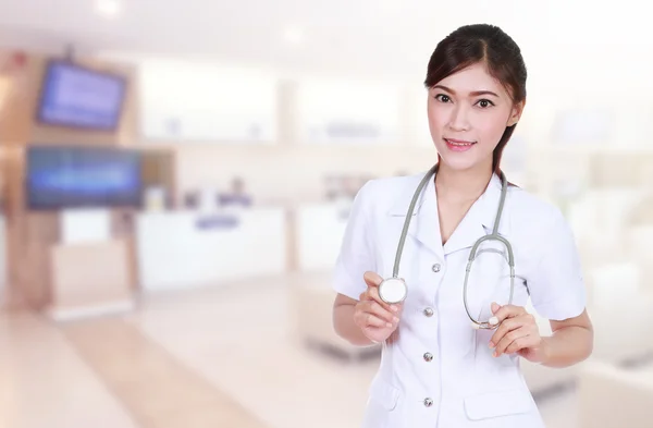 Nurse with stethoscope in hospital background — Stock Photo, Image