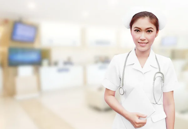 Nurse with stethoscope and medical report in hospital — Stock Photo, Image