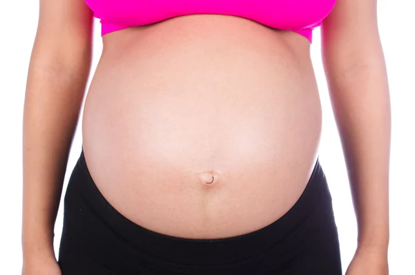 Gros plan du ventre de la femme enceinte isolé sur blanc — Photo