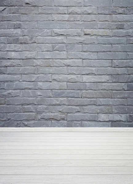 Wnętrza pokoju z kamienia cegły płytki ściany i drewniane podłogi backgro — Zdjęcie stockowe