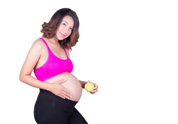 Bella donna incinta con mela verde isolata su bianco — Foto Stock