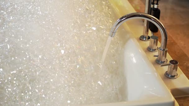 Water Flow Faucet Bathtub Soap Foam Bubbles — Stock Video