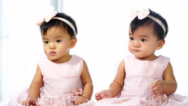 Cheerful Twin Babies Playing Color Ball Bed — Stock Video