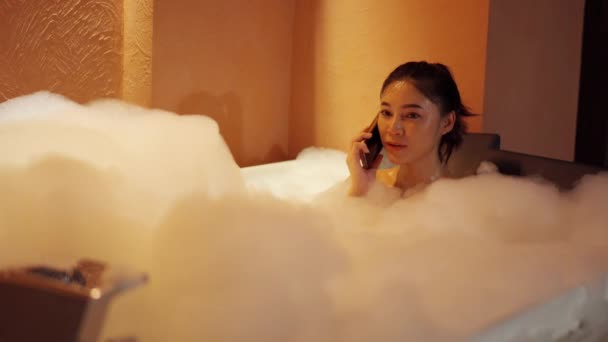 Woman Talking Mobile Phone Bathtub Night — Stock Video