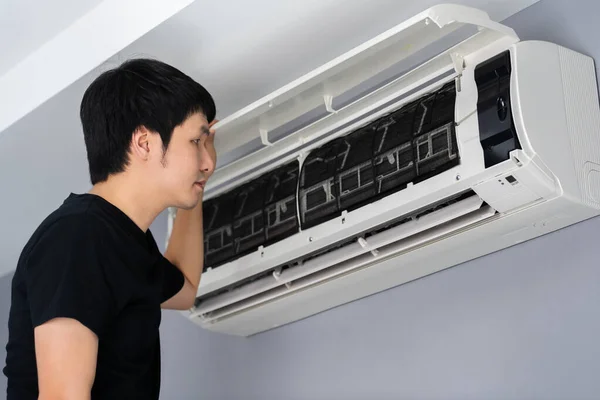 Young Man Open Air Conditioner Indoor Home — Stock Photo, Image
