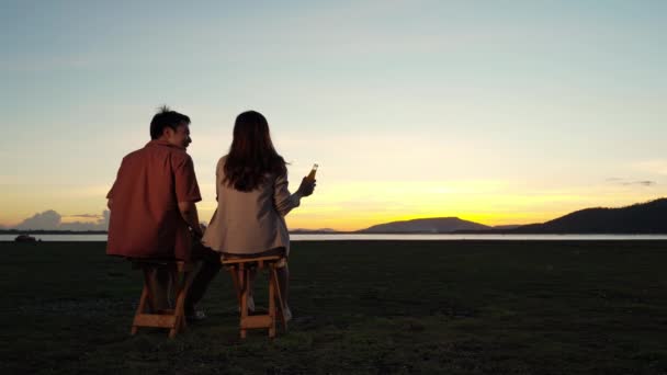 Cheerful Couple Love Talking Sitting Grass Filed Sunset — Stock Video