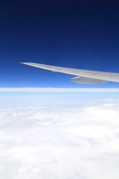 Airplane wing above sky — Stock Photo, Image