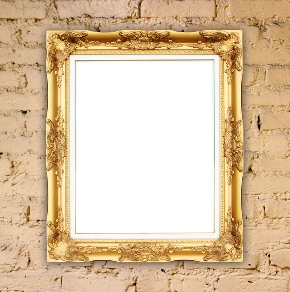 Lege gouden frame op stenen muur — Stockfoto