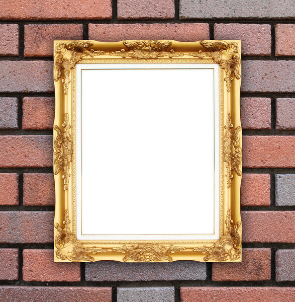 Blank golden frame on brick stone wall background