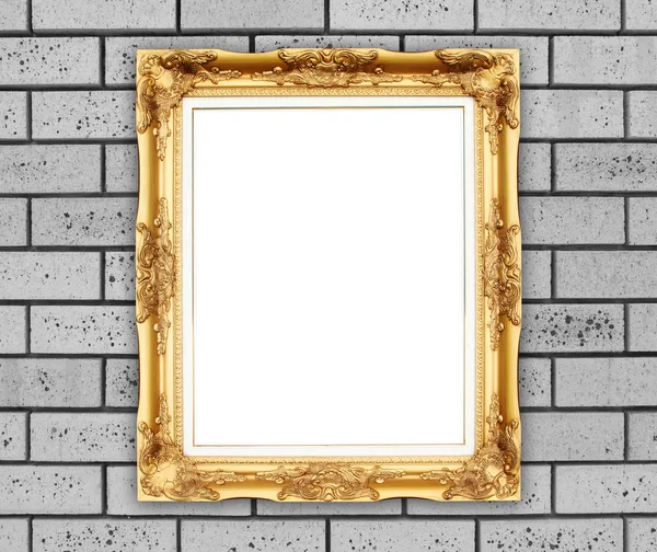 Blank golden frame on brick stone wall — Stock Photo, Image