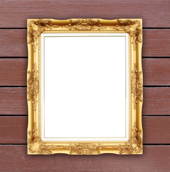 Blank golden frame on wood wall — Stock Photo, Image