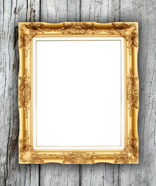 Blank golden frame on wood wall — Stock Photo, Image