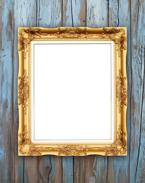 Lege gouden frame op houten muur — Stockfoto