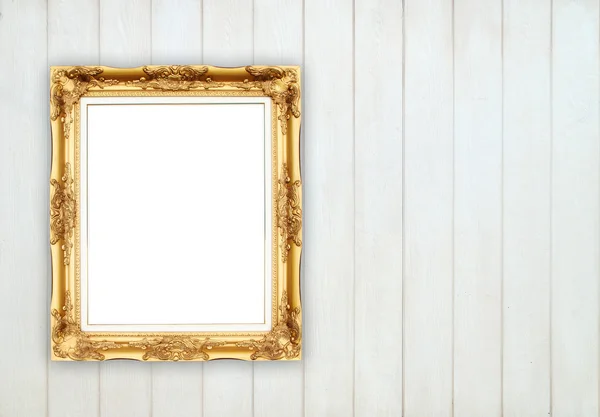 Lege gouden frame op houten muur — Stockfoto