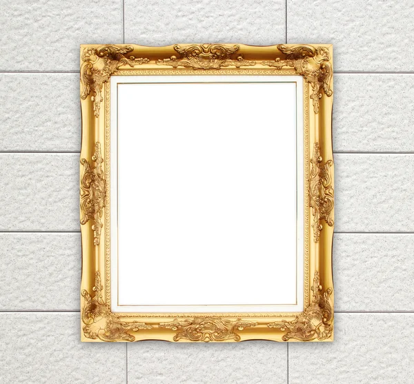Leerer goldener Rahmen auf Ziegelsteinmauer — Stockfoto