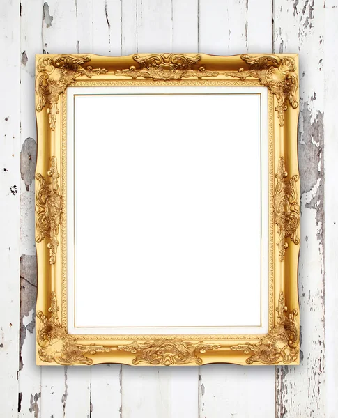 Blank golden frame on wood wall — Stock Photo, Image