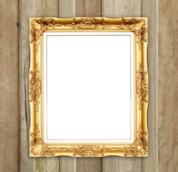 Leerer goldener Rahmen an Holzwand — Stockfoto