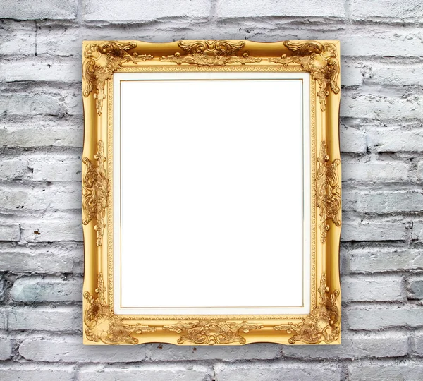 Blank golden frame on brick stone wall — Stock Photo, Image