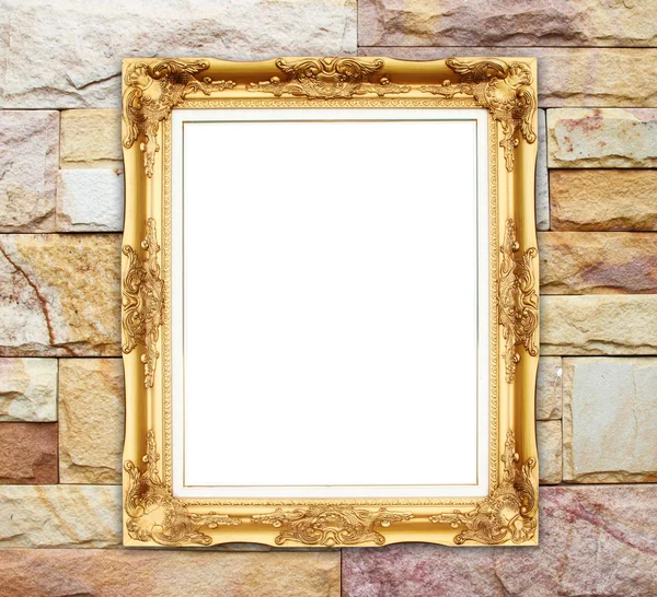 Blank golden frame on brick stone wall — Stock Photo, Image