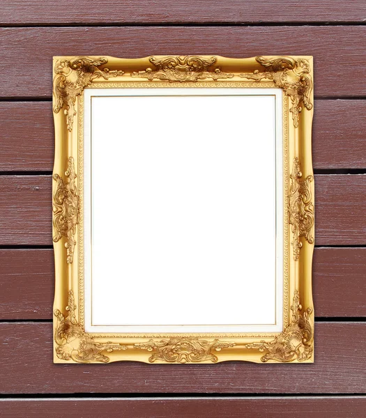 Lege gouden frame op houten muur — Stockfoto