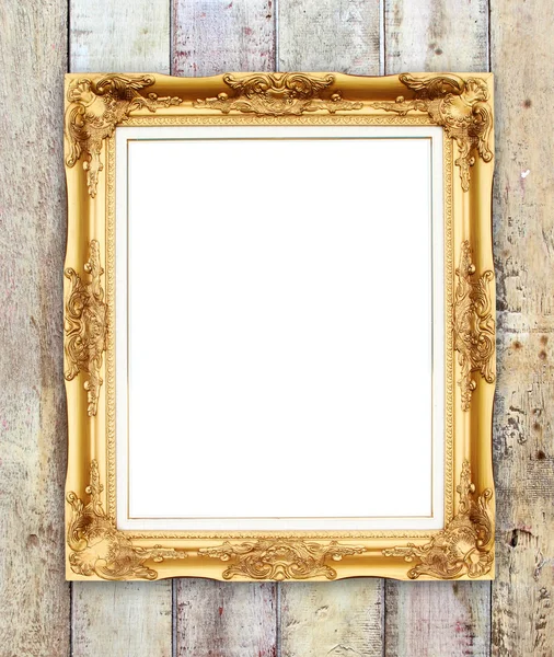 Lege gouden frame op houten muur — Stockfoto