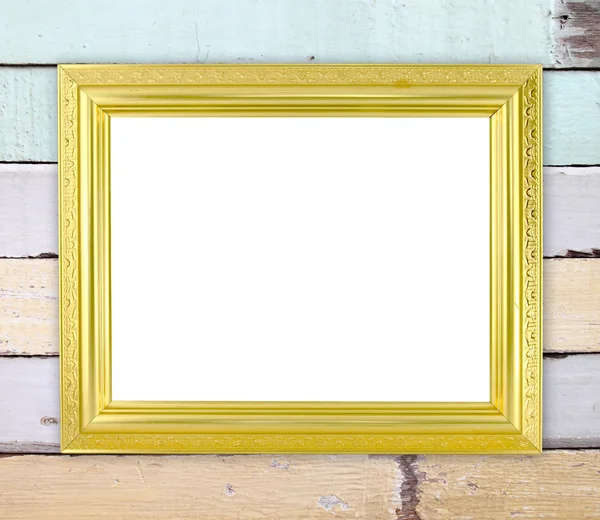 Puste złotej ramie na ścianie drewna — Zdjęcie stockowe
