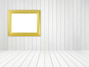 Beyaz ahşap duvar ve ahşap zemin ile odada boş altın çerçeve 