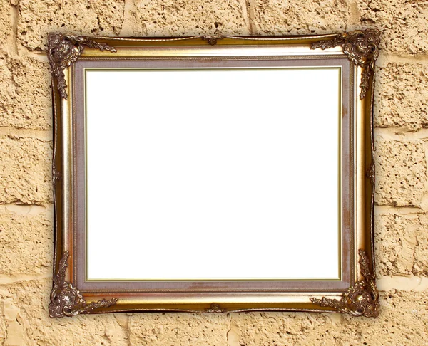 Golden frame on brick stone wall background — Stock Photo, Image