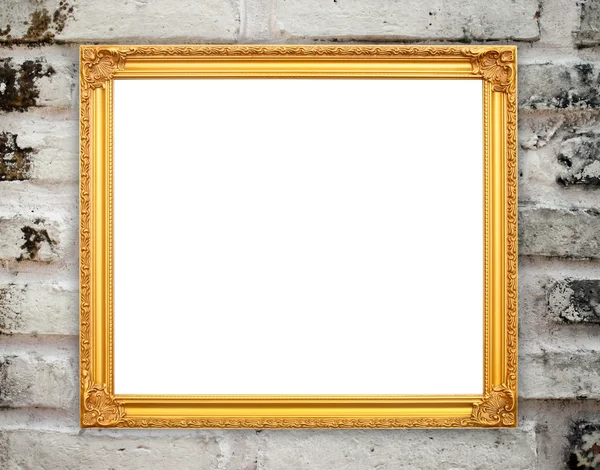 Blank golden frame on brick stone wall — Stock Photo, Image