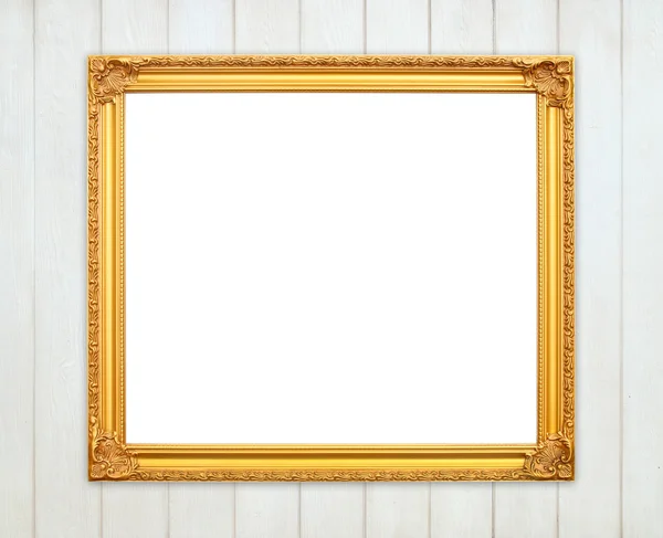 Blank golden frame on wood wall — Stock Photo, Image