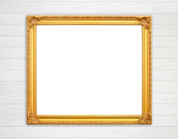 Lege gouden frame op houten muur — Stockfoto