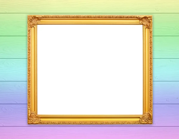 Blank golden frame on wood wall — Stock Photo, Image