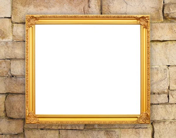 Пустая золотая рамка на кирпичной каменной стене — стоковое фото