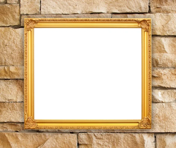 Lege gouden frame op stenen muur — Stockfoto