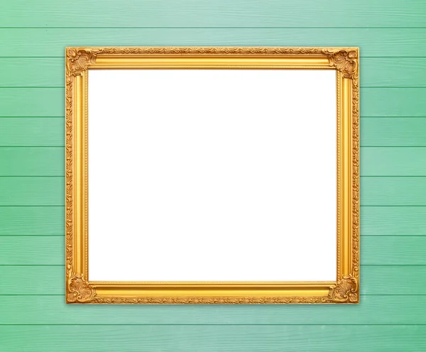 Lege gouden frame op houten muur — Stockfoto