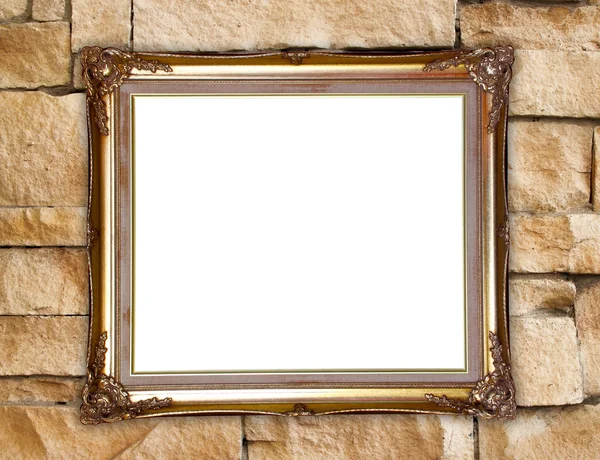 Gouden frame op baksteen stenen muur achtergrond — Stockfoto