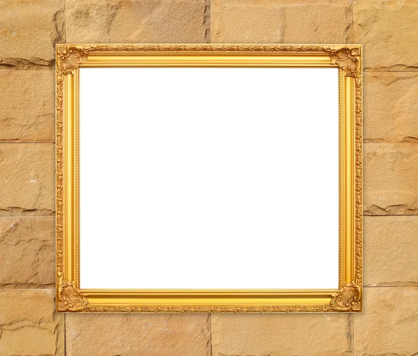 Blank golden frame on brick stone wall — Stock Photo, Image