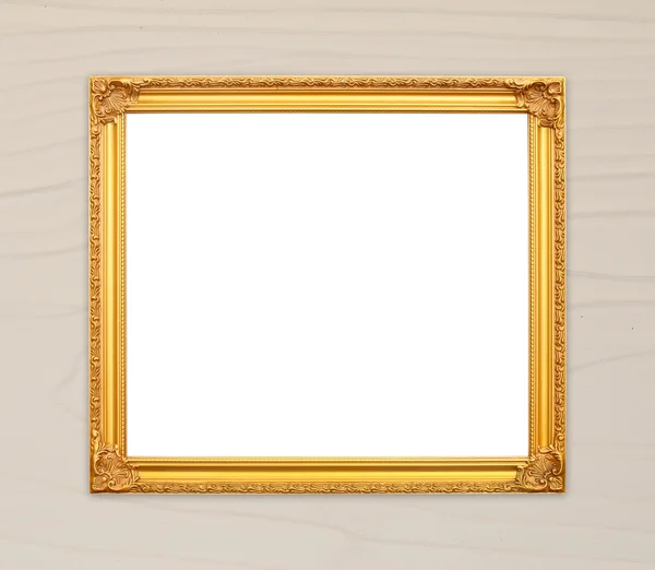 Lege gouden frame op houten muur — Stockfoto