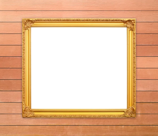 Blank golden frame on wood wall — Stock Photo, Image