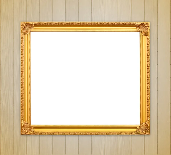 Lege gouden frame op houten muur — Stockfoto