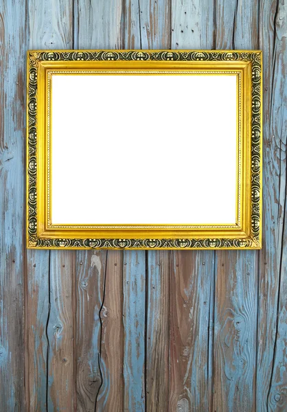 Lege gouden frame op houten muur — Stockfoto