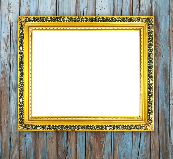 Blank golden frame on wood wall — Stock Photo, Image