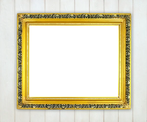 Lege gouden frame op houten muur — Stockfoto