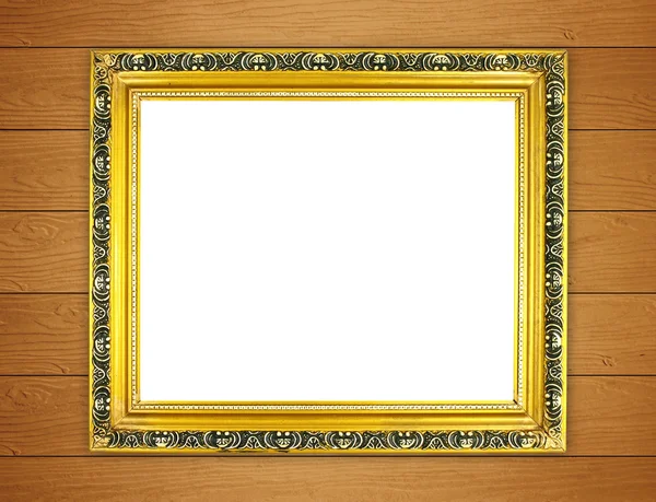 Lege gouden frame op houten muur — Stockfoto