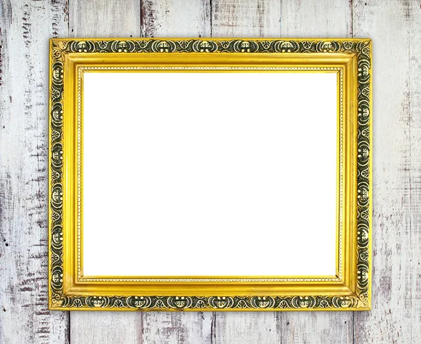 Blank golden frame on wood wall — Stock Photo, Image